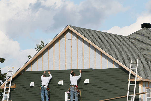 Professional Storm Damage Siding Repair technician working in Rochester, IL
